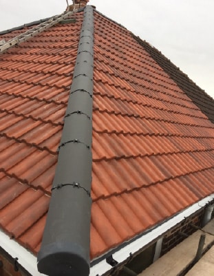 Experienced roofers in Harrogate carrying out tile roof repairs.