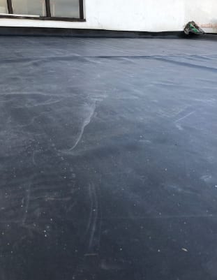 Local roofers in Harrogate installing durable flat roofing